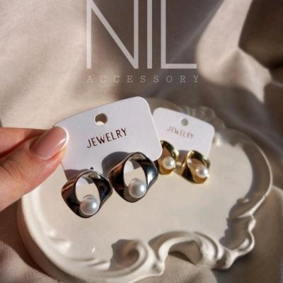 گوشواره مرواریدی با ابکاری رادیوم