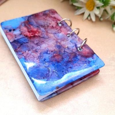 دفترچه رزینی ابروبادی آبی قرمز