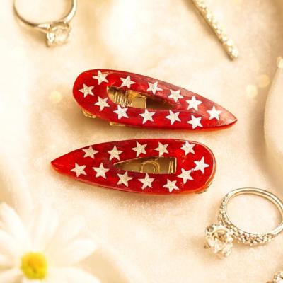 گیره مو رزینی قرمز ستاره دار