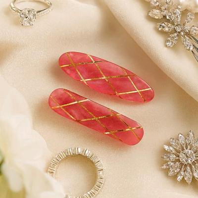 گیره رزینی صورتی طلایی