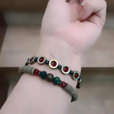 ست دو عددی دستبند حدید و کریستال سبز و زرشکی