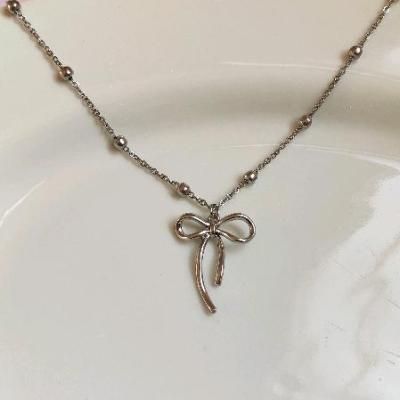 گردنبند پاپیون با زنجیر توپی سفید