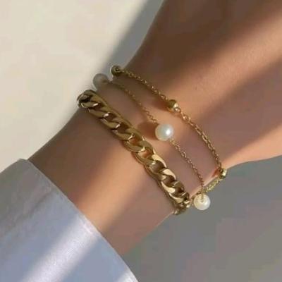 دستبند استیل و رنگ ثابت سه ردیفهکارتیر و مروارید و زنجیر توپی-153877