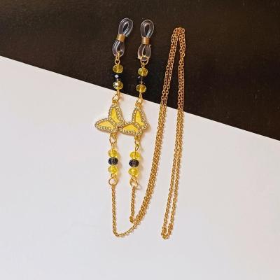 بند عینک زنجیری زرد استیل مدل پروانه نگین دار