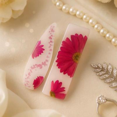 گیره رزینی بابونه صورتی