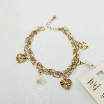 دستبند سه ردیف طلایی آویزدار ، کار شده با مروارید آب شیرین اصل