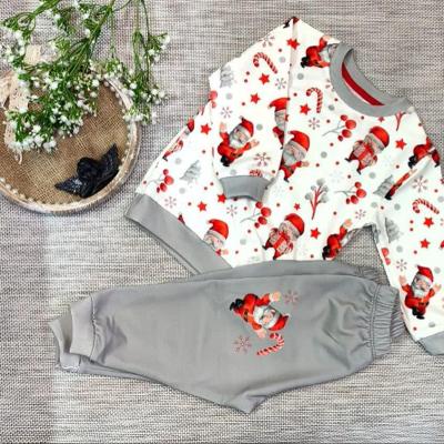 بلوز و شلوار بچگانه راحتی اسپرت مناسب دختر و پسر طرح بابانوئل